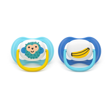 Load image into Gallery viewer, Orthodontic pacifiers, two showing the silicone nipple shape. Blue and yellow colors with monkey and banana graphics for baby comfort and oral development.
