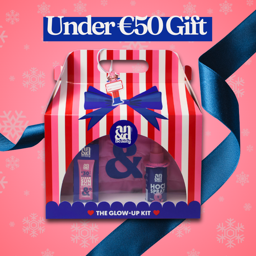 AND Beauty glow up kit packshot with Blue Ribbon on a Pink Background