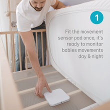 Load image into Gallery viewer, Angelcare AC25-1 movement Sensor Pad being fitted underneath a cot mattress
