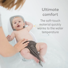 Load image into Gallery viewer, Baby resting comfortably in the Angelcare Soft Touch Mini Bath Support with quick-warming material
