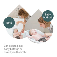 Load image into Gallery viewer, Parent using Angelcare bath support for safe and convenient baby bathing

