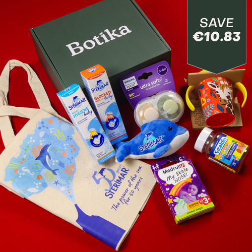 A Botika subscription box containing baby and child health products, including Sterimar nasal sprays, Philips Avent pacifiers, a dolphin plush toy, a sippy cup, Medrull My Little Nose patches, and Vitalids vitamins.