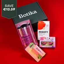 Load image into Gallery viewer, A Botika subscription beauty box containing a Real Techniques brush set, Hero Mighty Patch acne patches, Violet pre-glued reusable lashes, and Papaw lip balm on a red background.

