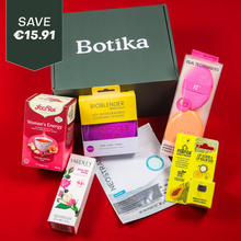 Load image into Gallery viewer, An open Botika subscription box showcasing contents like a Neostrata sheet mask, Yogi Tea, Real Techniques sponges, EcoTools BioBlender, and Dr. Pawpaw lip duo kit.
