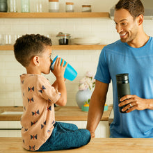 Load image into Gallery viewer, Blue Munchkin Miracle® 360° Sippy Cup, 10oz/296ml capacity, designed for toddlers 12 months and up. Spoutless, BPA-free, spill-proof, easy to clean, and supports dental health.
