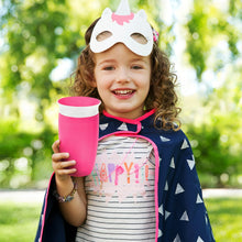 Load image into Gallery viewer, Smiling young girl holding a pink Munchkin Miracle® 360° Sippy Cup, 10oz capacity. Ideal for kids aged 12 months and up, featuring a spill-proof, BPA-free design with a spoutless 360° drinking edge for easy use and dental health support.
