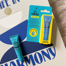 Load image into Gallery viewer, Dr. PAWPAW Lip &amp; Eye Balm 8ml in a blue tube alongside its original packaging, displayed on a patterned fabric background.
