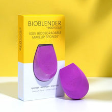 Load image into Gallery viewer, EcoTools BioBlender 100% biodegradable purple makeup sponge displayed next to its product packaging against a yellow backdrop.

