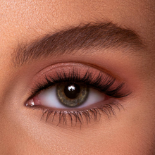 Load image into Gallery viewer, Model wearing Eyecha Dusk lashes showing fluffy curl and winged volume with soft cat-eye shape
