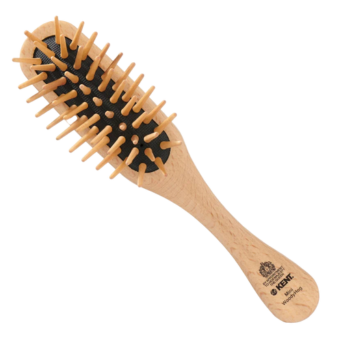 Kent Mini WoodyHog Wooden Pin Cushion Brush. This compact, travel-friendly brush is ideal for kids' hair or on-the-go detangling, featuring gentle wooden pins for scalp comfort and static reduction.