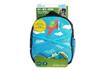 Load image into Gallery viewer, Close-up of the Munchkin Brica By-My-Side safety harness backpack for toddlers, featuring a blue airplane graphic and reflective safety strips.
