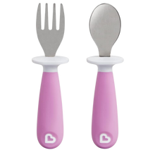 Load image into Gallery viewer, Munchkin Raise Toddler Fork and Spoon Set in purple, featuring ergonomic handles and a built-in base that keeps utensil tips off dirty surfaces to ensure a hygienic feeding experience.
