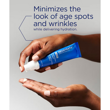 Load image into Gallery viewer, A close-up marketing image showing hands with a light-colored manicure dispensing NeoStrata Skin Active Firming Potent Retinol Complex from a blue tube onto a palm. Text above the product states that it minimizes the look of age spots and wrinkles while delivering hydration.

