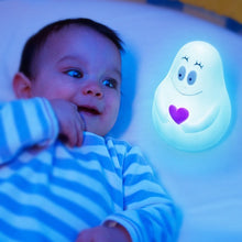 Load image into Gallery viewer, Pabobo Lumilove Barbapapa glowing nightlight with a heart, providing a soft blue glow and reassuring presence next to a happy baby in a crib.

