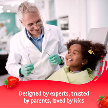 Load image into Gallery viewer, A friendly male dentist smiling at a young girl in a dental chair with the text "Designed by experts, trusted by parents, loved by kids."
