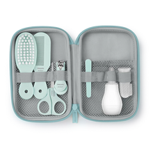 Load image into Gallery viewer, Open light blue zip case neatly displaying the full Philips Avent baby care kit including hairbrush, comb, scissors, nail clippers, nasal aspirator, and finger toothbrush, available with free delivery across Malta &amp; Gozo.
