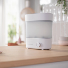 Load image into Gallery viewer, Philips Avent bottle sterilizer placed on kitchen counter, ready for baby feeding prep.
