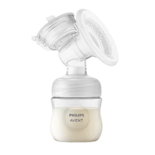Load image into Gallery viewer, Philips Avent electric breast pump expression kit showing the clear silicone cushion flange attached to a wide-neck baby bottle containing breast milk.
