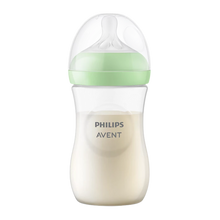 Load image into Gallery viewer, A Philips Avent Natural baby bottle filled with milk, featuring a light green screw ring and a clear protective cap, isolated on a white background.
