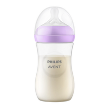 Load image into Gallery viewer, A Philips Avent Natural baby bottle filled with milk, featuring a light purple screw ring and a clear protective cap, isolated on a white background.
