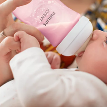 Load image into Gallery viewer, Baby drinking from a Philips Avent Natural Response Pink Baby Bottle 260ml
