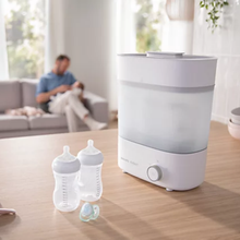Load image into Gallery viewer, Philips Avent Premium Bottle Steriliser &amp; Dryer with baby bottles and soother on a kitchen counter
