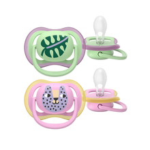 Load image into Gallery viewer, A 2-pack of Philips Avent Ultra Air soothers (SCF087/13) for girls 6–18m featuring leaf and tiger designs with a breathable shield for sensitive skin.
