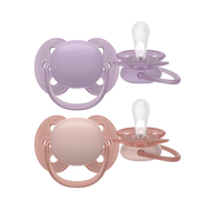 A 2-pack of Philips Avent Ultra Soft soothers (SCF091/43) for girls 6–18m in lavender purple and rose pink with flexible shields for fewer skin marks.