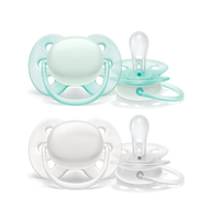 Philips Avent translucent Soothie pacifiers in mint green and white, made of soft silicone with symmetrical orthodontic design