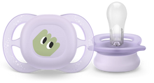 Load image into Gallery viewer, A close-up of a lavender purple Philips Avent Starter soother for infants 0–2 months, featuring a small lightweight shield with a hand graphic and a clear silicone nipple.

