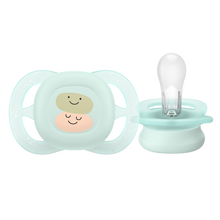 Load image into Gallery viewer, Front and side view of a light green Philips Avent Ultra Air pacifier featuring two smiling character icons and a soft silicone teat.
