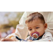 Load image into Gallery viewer, Philips Avent Ultra Air Soother (6-18 months) in use, featuring the breathable flower design and a lightweight shield for a baby's comfort.
