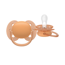 Load image into Gallery viewer, A close-up of a terracotta orange Philips Avent Ultra Soft soother for toddlers 18 months and older, featuring a flexible shield for sensitive skin and a clear silicone nipple.

