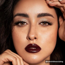 Load image into Gallery viewer, Mahshidbeautyblog wearing MIA lashes with soft glam and bold burgundy lips.
