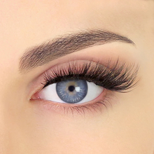 Load image into Gallery viewer, Close-up eye wearing Pinky Goat REEM lashes with lifted curl and fluffy volume.
