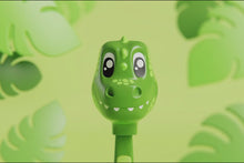 Load and play video in Gallery viewer, A 3D animated video showcasing the Aquafresh Little Teeth toothbrush character caps against distinct thematic backgrounds. It transitions through four characters: a green crocodile smiling amid jungle leaves, a calico cat blinking against a backdrop of orange yarn balls, a white unicorn with a pink and green mane nodding among fluffy clouds, and a brown dog winking while cartoon bones float in the background.
