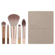 Load image into Gallery viewer, Packaged Real Techniques New Nudes 2.0 On-The-Glow Mini Brush Set with mirrored compact displayed alongside the included five mini makeup brushes.
