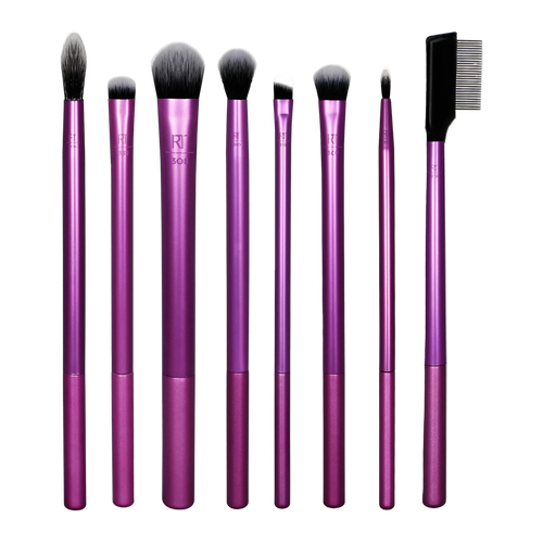 Complete set of Real Techniques eye makeup brushes with metallic purple handles, featuring brushes for blending, crease work, concealer, and an eyebrow comb.