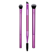 Load image into Gallery viewer, Real Techniques Eye Shade + Blend 3-piece set cutout, featuring a shading brush, a deluxe crease brush, and a dual-ended brow/liner tool with purple handles for defining eye looks.
