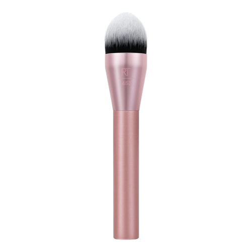 Real Techniques RT 452 Expert Face Brush with pink handle and dense, flat-top head, ideal for buffing and blending liquid foundation, cream blush, or contour products.