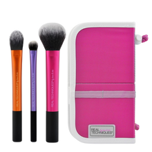 Load image into Gallery viewer, Real Techniques Travel Essentials Set, featuring three full-size brushes (RT 200, RT 400, RT 300) and a portable, upright pink brush case for on-the-go makeup application.
