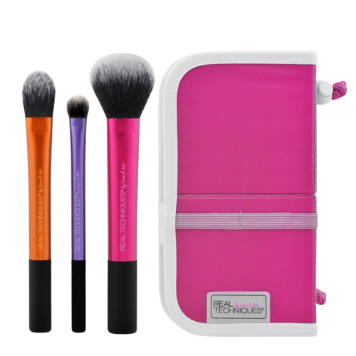 Real Techniques Travel Essentials Set, featuring three full-size brushes (RT 200, RT 400, RT 300) and a portable, upright pink brush case for on-the-go makeup application.