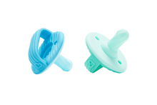 Load image into Gallery viewer, A blue silicone teether ring and a light green silicone pacifier, both designed for infants 3 months and up.
