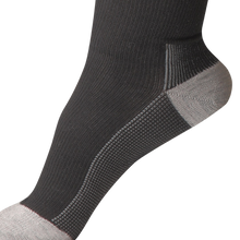 Load image into Gallery viewer, Close-up of Uriel Silver Flight Compression Socks showing the knitted fabric texture, reinforced heel and toe areas, and detailed stitching.
