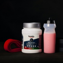 Load image into Gallery viewer, A jar of Vitaldin Sport Recovery watermelon powder next to a protein shaker bottle and fresh watermelon slices on a gym floor.
