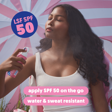 Load image into Gallery viewer, A woman applying a fine mist of water and sweat-resistant SPF 50 sun spray while outdoors.
