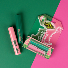 Load image into Gallery viewer, WICKED x Dr. PAWPAW Enchanting &amp; Glimmer Lip Balm Duo displayed with its green and pink packaging on a matching two-tone background.
