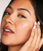 Load image into Gallery viewer, Close-up of a person applying the Neostrata Post-Acne Mark Correcting Serum to their cheek.
