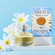 Load image into Gallery viewer, Yardley English Daisy Eau De Toilette 50ml bottle and box displayed with fresh daisies, featuring a 94% natural floral fragrance formula.
